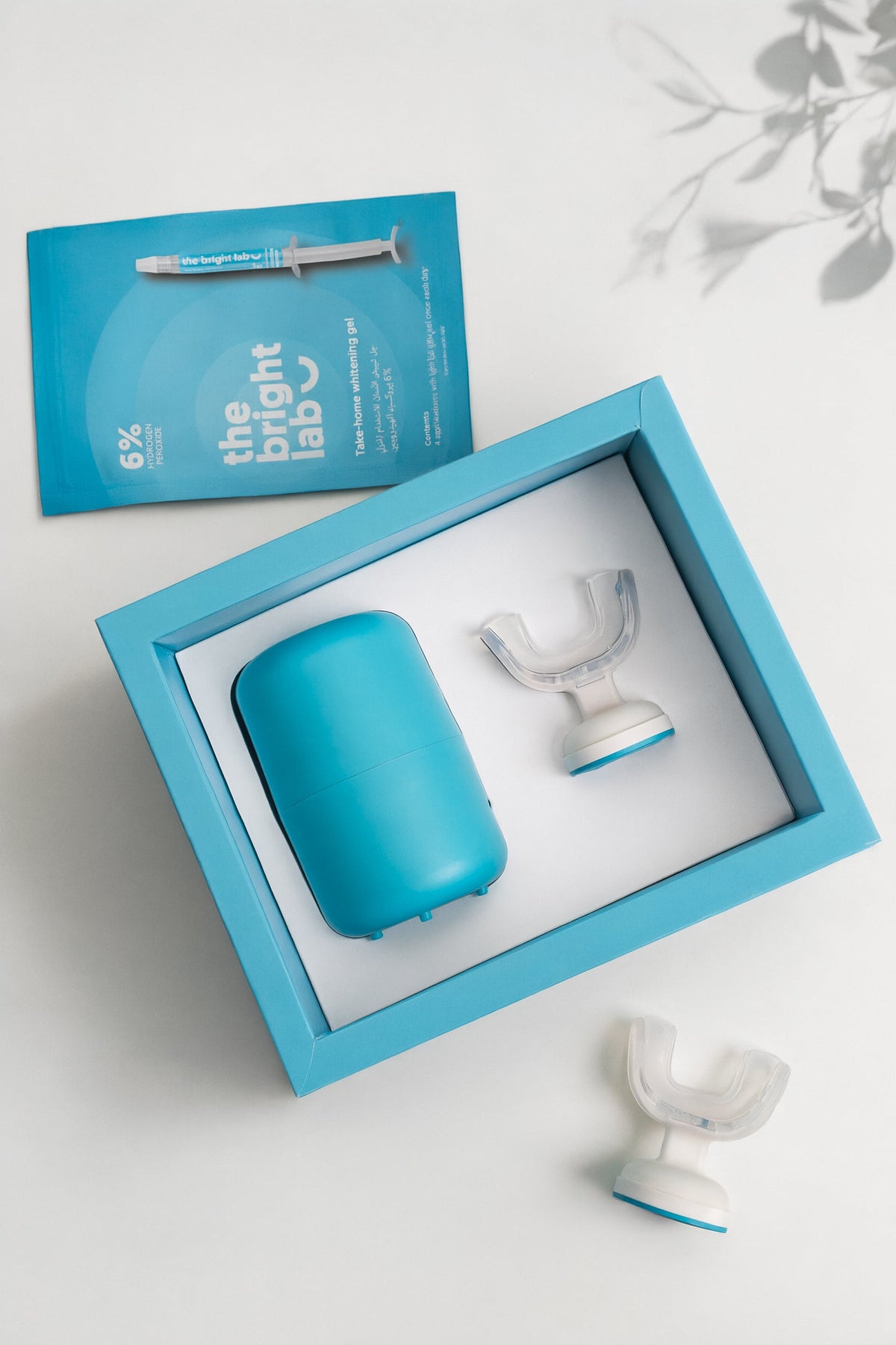 The Bright Lab whitening gel refill sachet beside the open Whitening System box