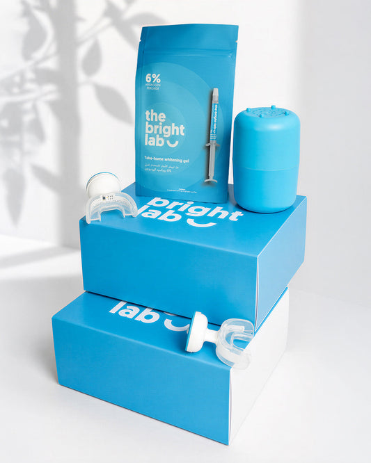 The Bright Lab Whitening System: retail boxes, whitening gel sachet, teal charging case and LED mouthpiece