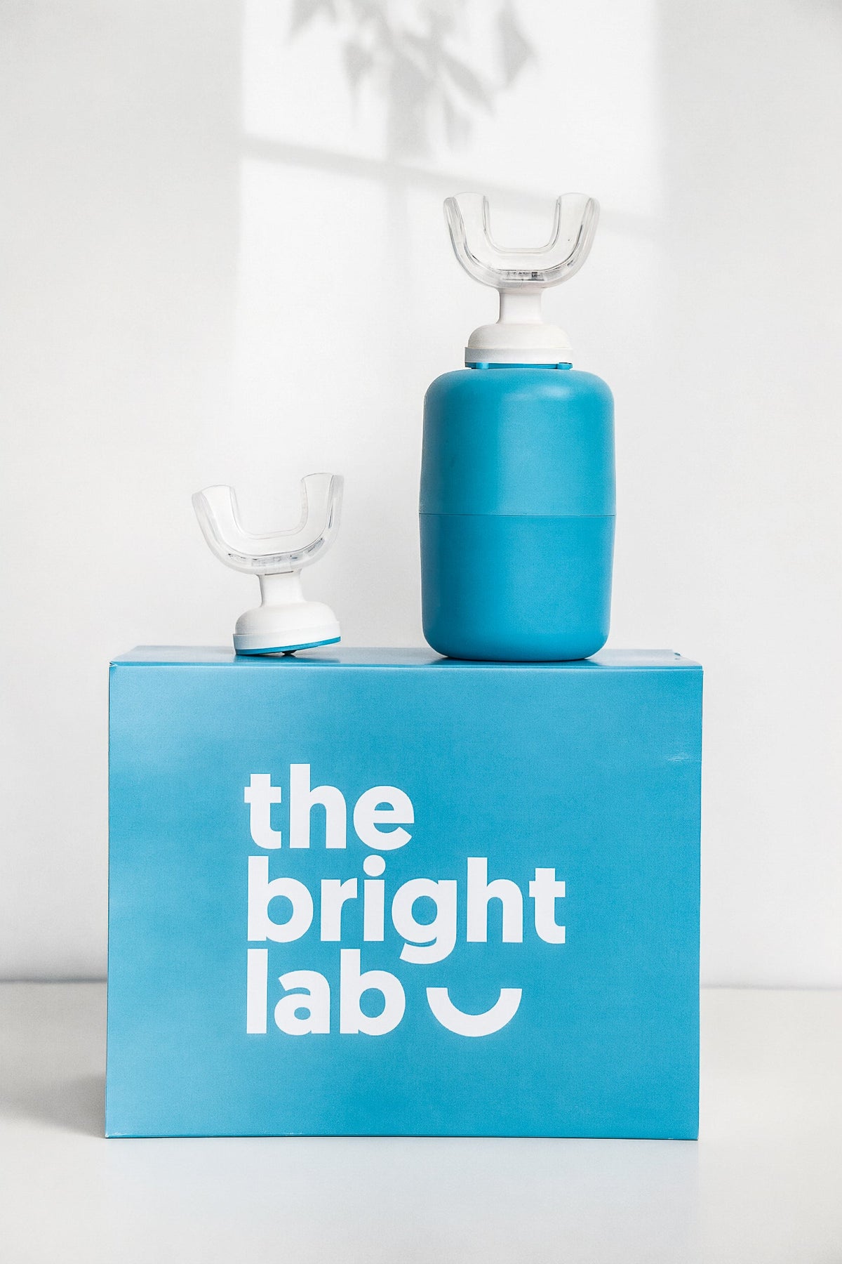 The Bright Lab case and mouthpiece standing on the branded box