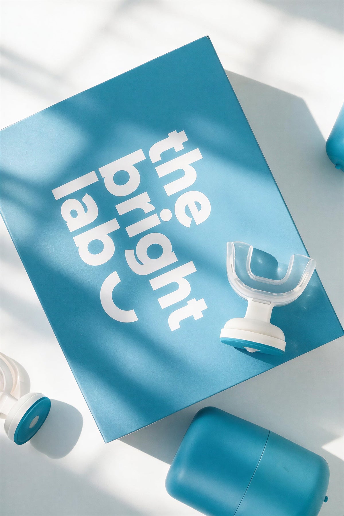 The Bright Lab branded box with the mouthpiece and case laid flat